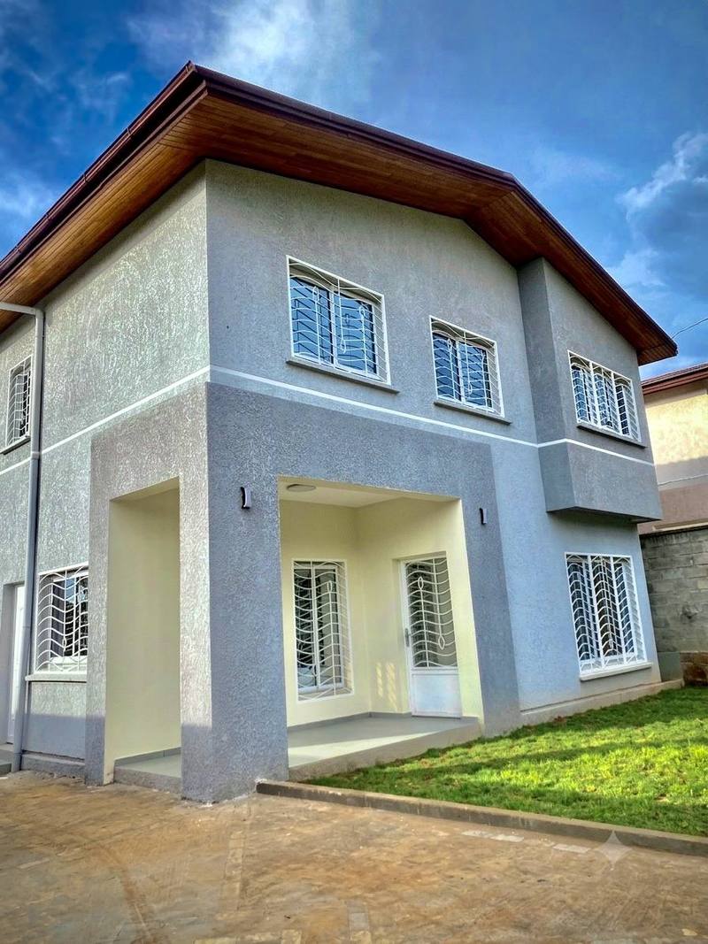 Façade et jardin d’une maison Kemet Home